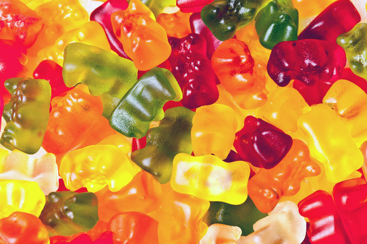 a collection of red yellow green gummy bears