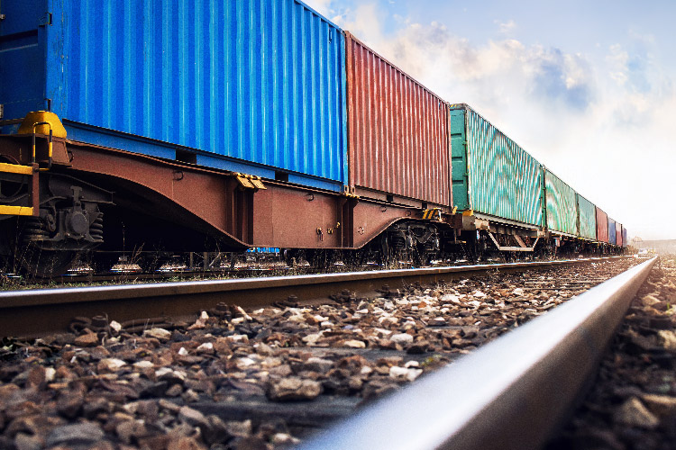 close up shot of rail tracks with rail containers